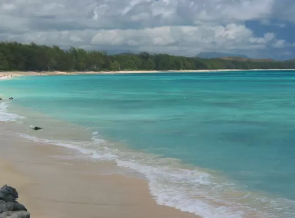 The stunning waters, near the orange-pink house at the south end of Waimanalo Beach.