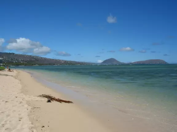 Views of clear waters and Koko Head, from Kahala beach.