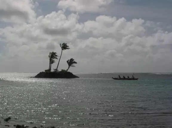 Outrigger canoe near the island.
