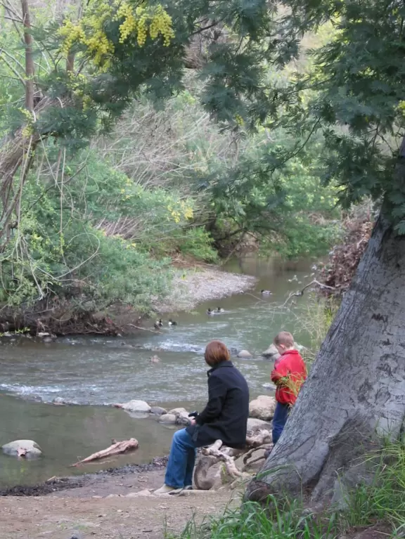 A mother and son enjoy peaceful Los Gatos Creek.