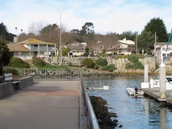 Walking the path beside the boats toward Custom House Plaza and Fisherman's Wharf.