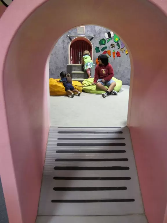 Crawl in through the tunnel.