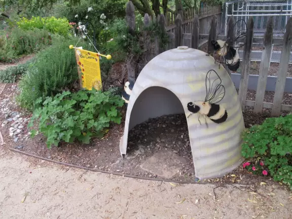 Kids can climb in this little bee hive.