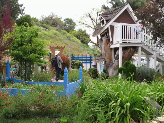 The crooked treehouse and flowerbed!