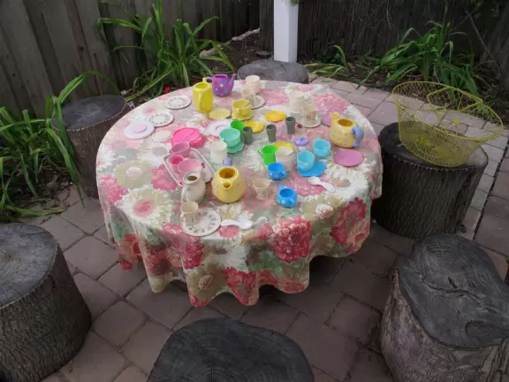 A tea party in the woods. Little girls play happily here for a long time.