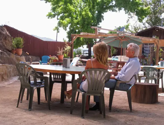 A couple enjoys the live music on a Sunday afternoon.