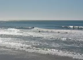 Popular surf spot, south of Mussel Shoals, on the Pacific Coast Highway, along a stretch of rock wall with not much sand.