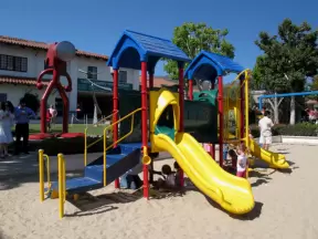 Playground, swings, and sandpit.