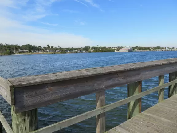 Park with shade, small playground, splash pad, and pier on the intracoastal.