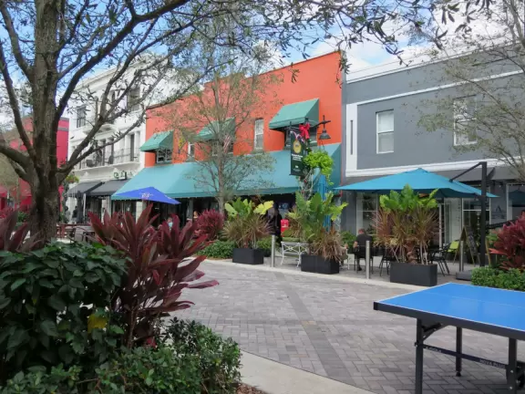 Main strip of West Palm Beach, with colorful and inviting architecture and decorations.