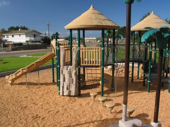 A fantastic tropical-themed playground, with ship,&nbsp; plus a big grassy lawn!