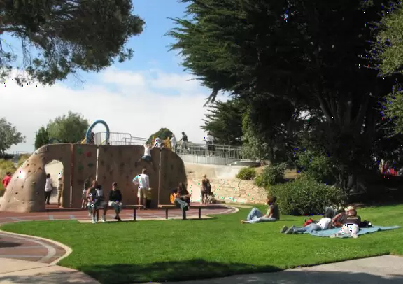 A super fun park with several unusual playgrounds, a rockclimbing wall, a Southern Pacific railroad engine, a swaying bridge, huge wavy slides on a hill, cement tunnels and more!