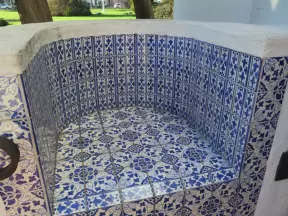 Blue tiled bench.