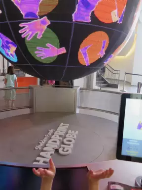 Handprint globe, which detects the heat of your hands.
