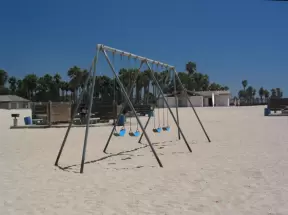Swings and picnic spots on the beach.