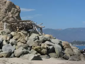 A lookout made of logs, where surfers sit to watch the action.