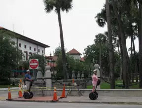 Tourists on segways in front of campus.