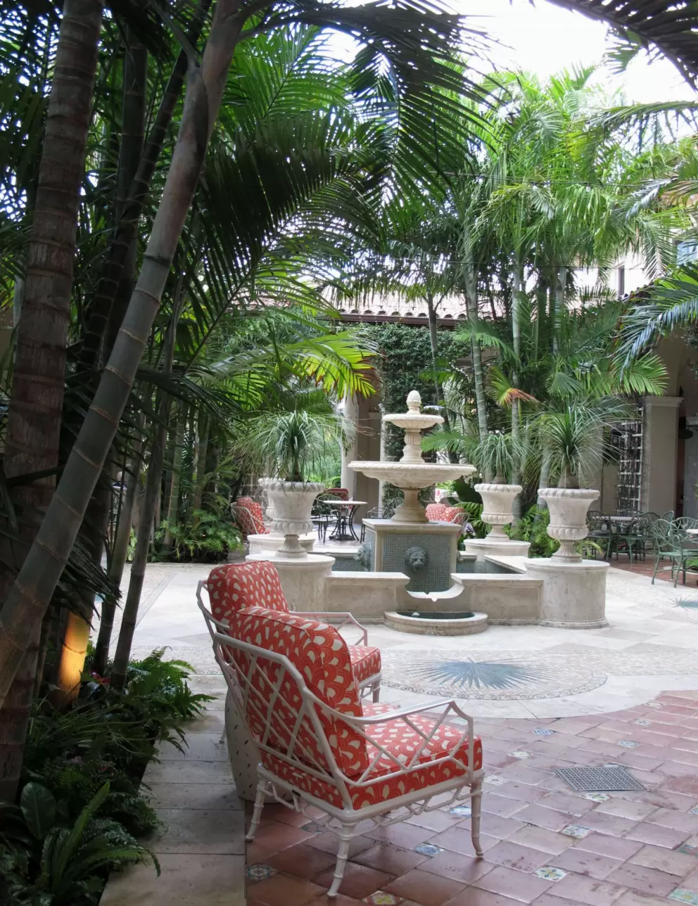 Palm Courtyard and orange chairs.