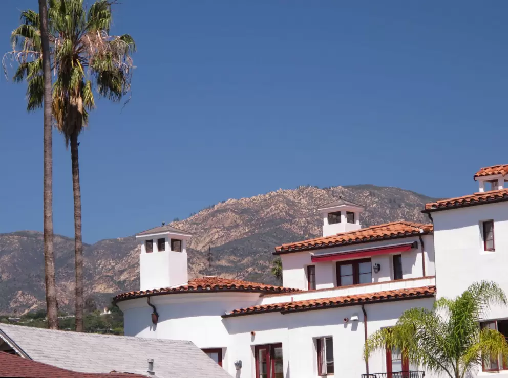 View of Spanish rooftop and mountains from Santa Barbara Street.