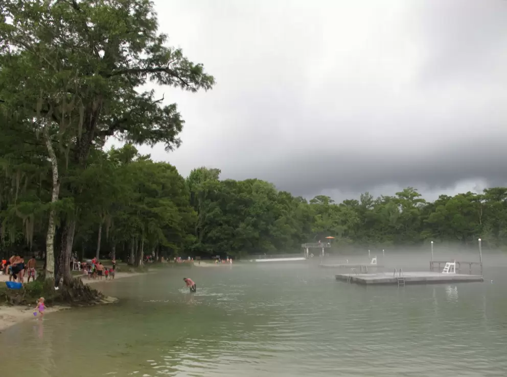 Swimmers must leave the water because of lightning.