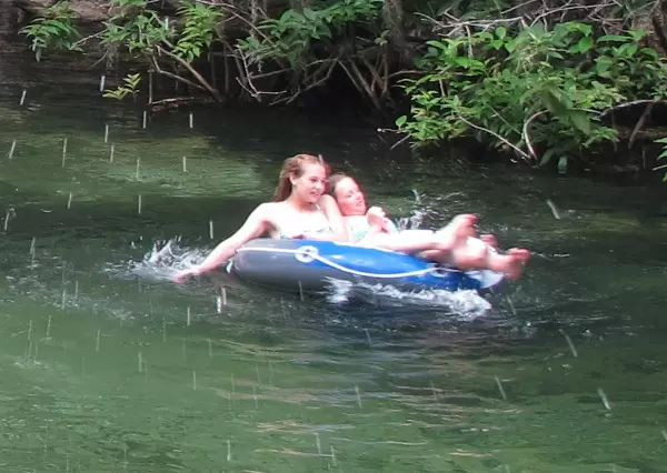 Enjoying a leisurely drift down the spring run in a rubber raft.