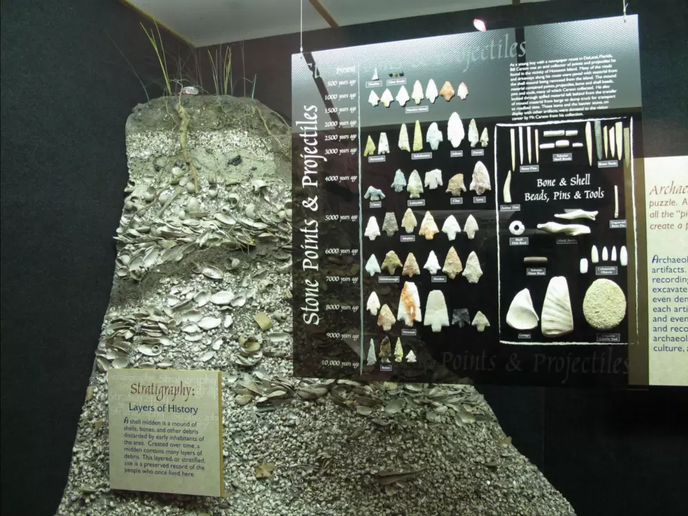 Display of points, projectiles, beads, pins, and tools collected by a young boy named Bill Carson.