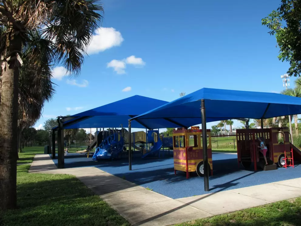 The two large blue shade canopies and the fire engine.