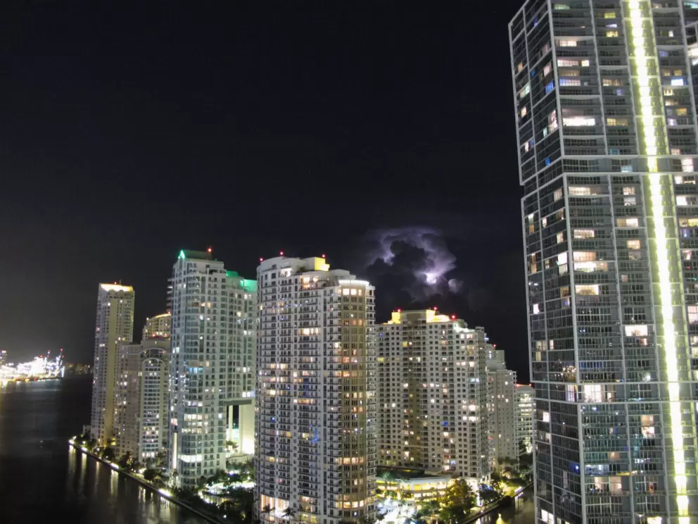 Impressive thunderstorm behind Brickell Key, as seen from 26th floor of Kimpton Epic Hotel.