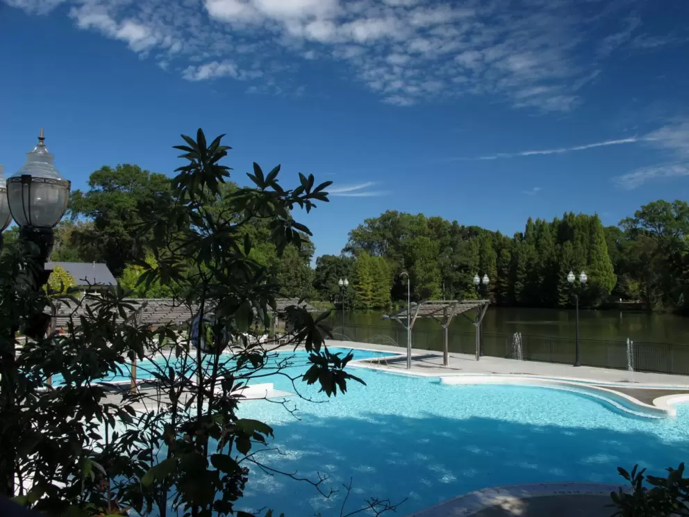 The aquatic center is situated beautifully on a lake.