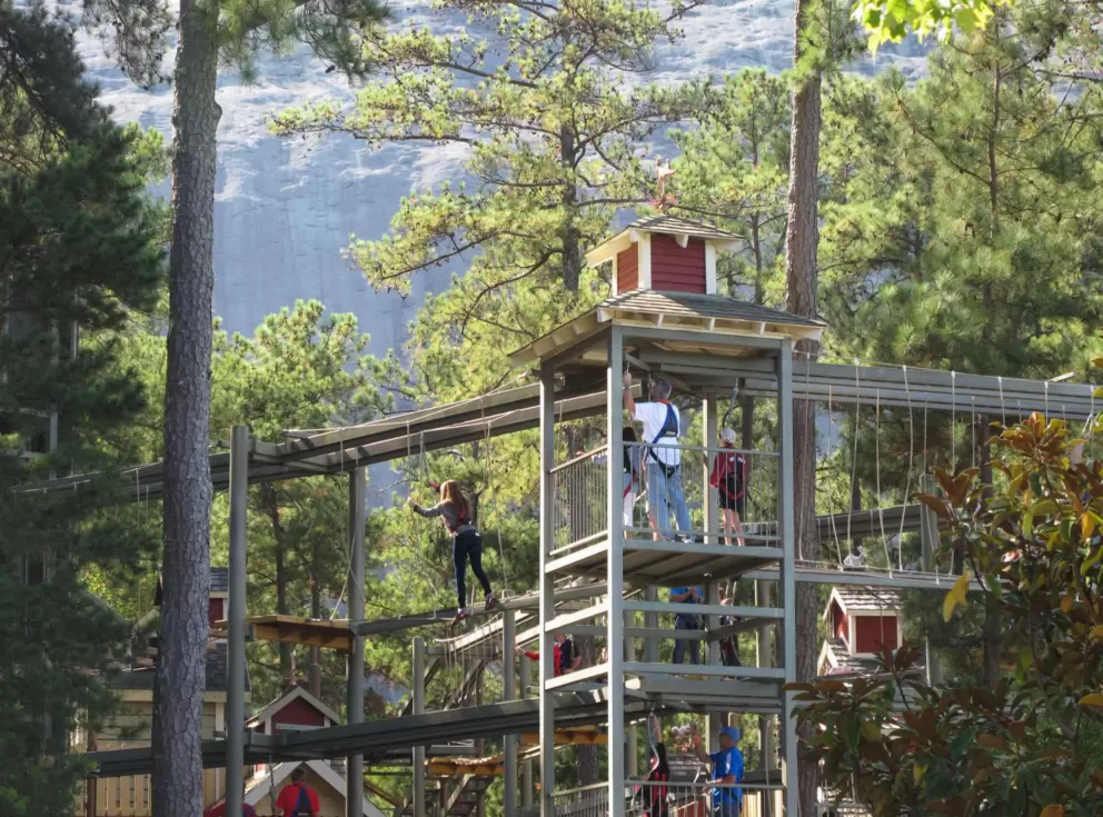 Guests make their way along the SkyHike in the village.