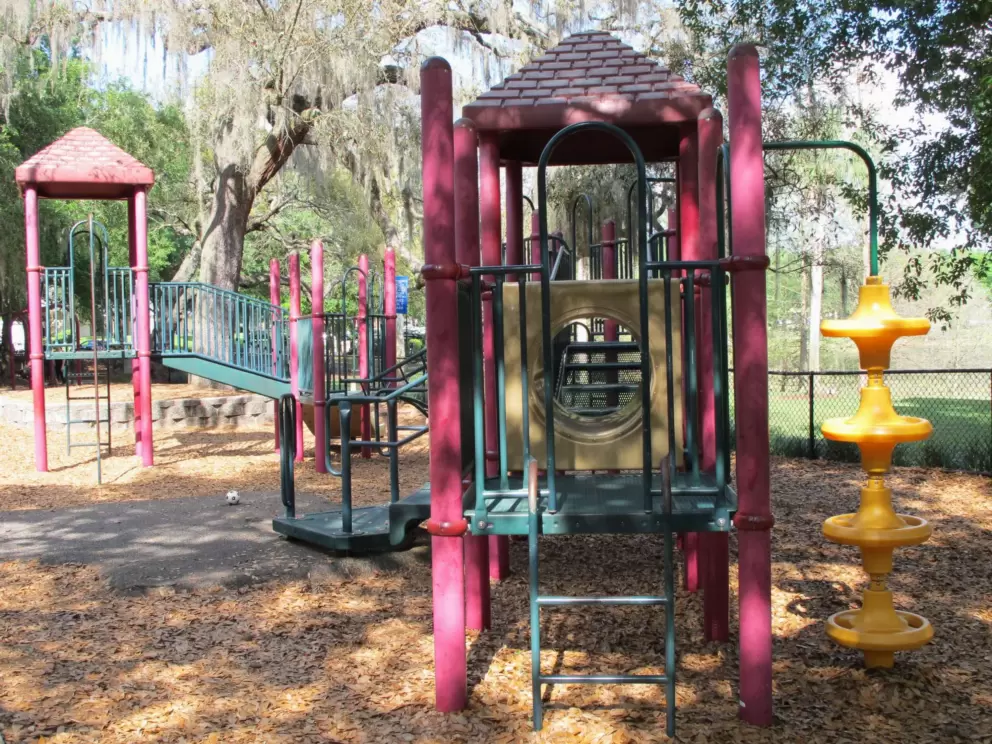 The fenced playground, with a view of the lake.