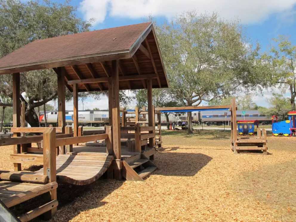 The SunRail train goes by, while kids can climb into the blue and yellow play train!
