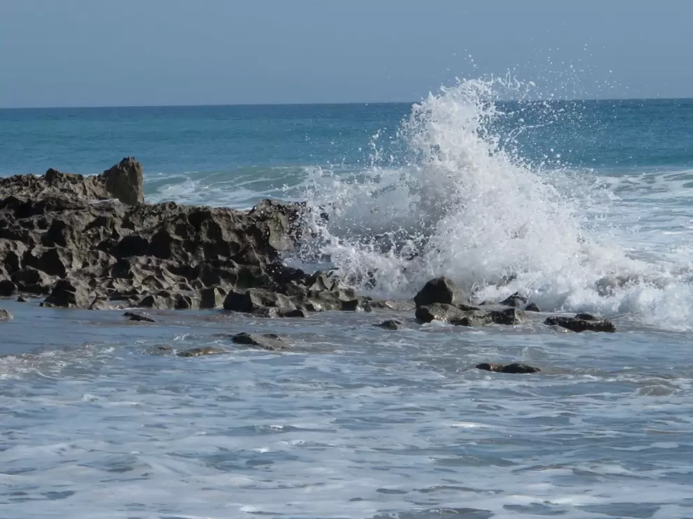 Waves splashing on the rocks.