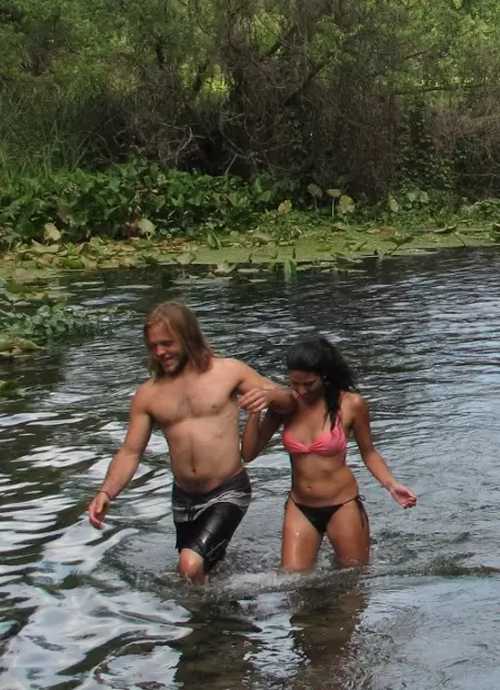A couple make their way from the river to the spring.