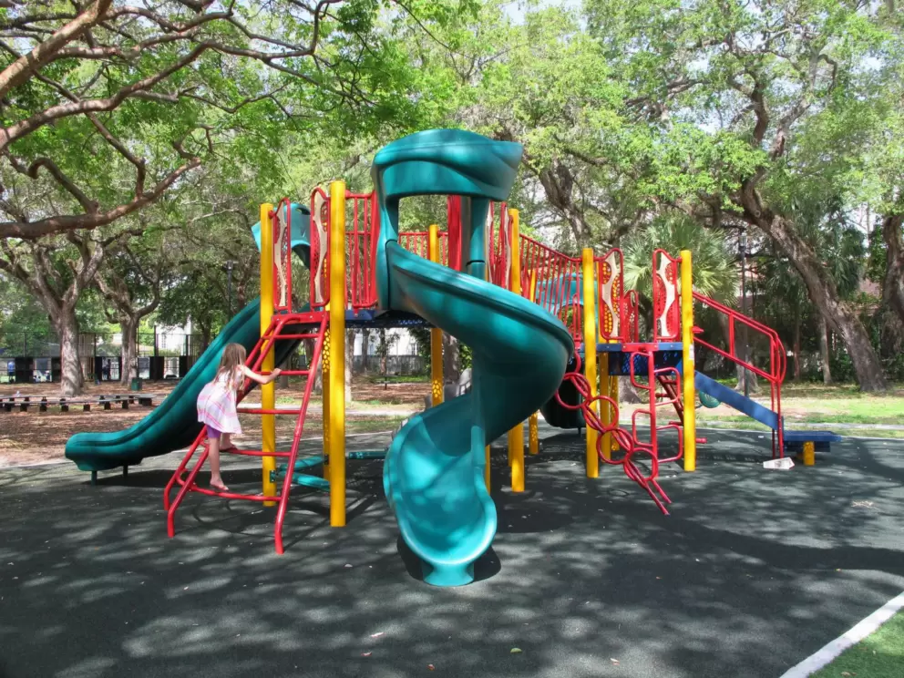 Playground with steep twisty slide.