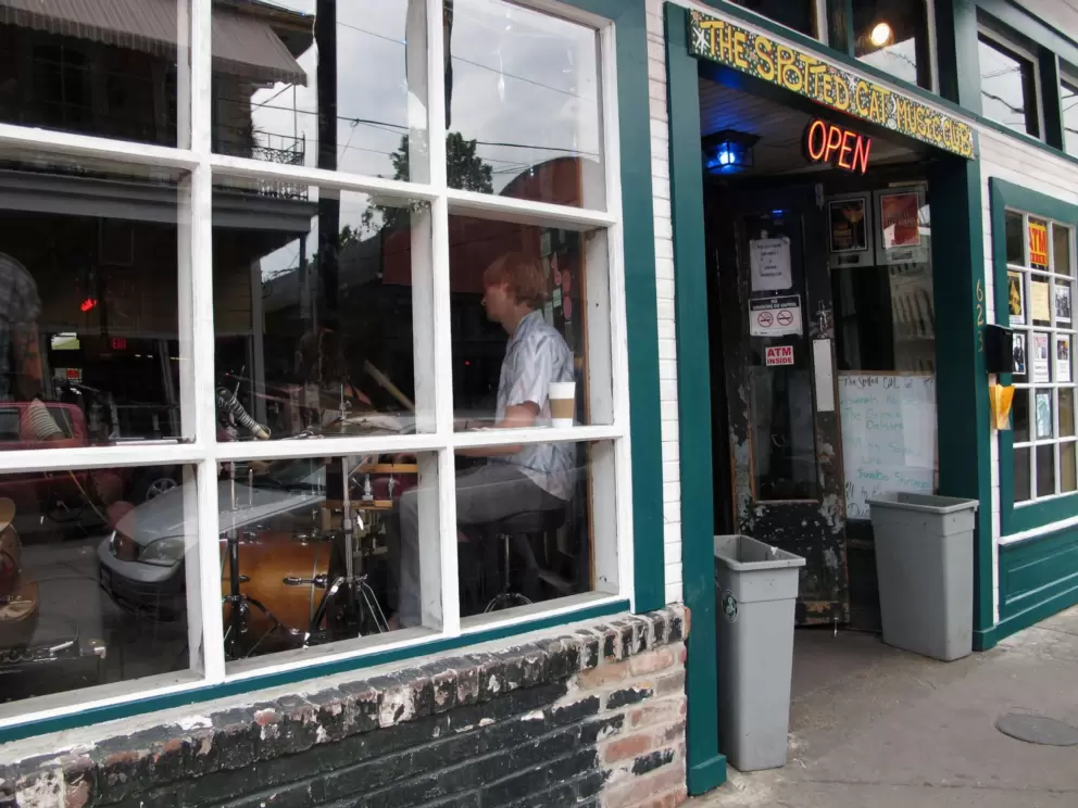 The Spotted Cat Music Club with a band by the window rocking the street!