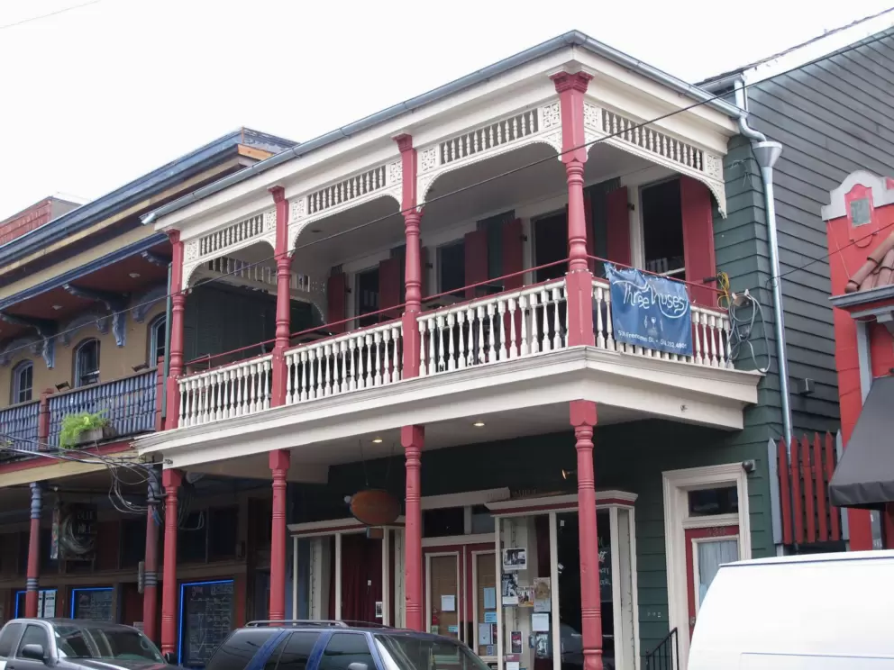 Three Muses, in a cream and red historic building.