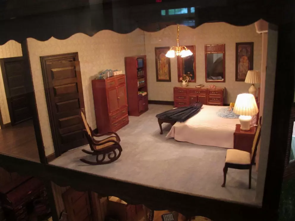 Incredibly lifelike bedroom in a doll house.