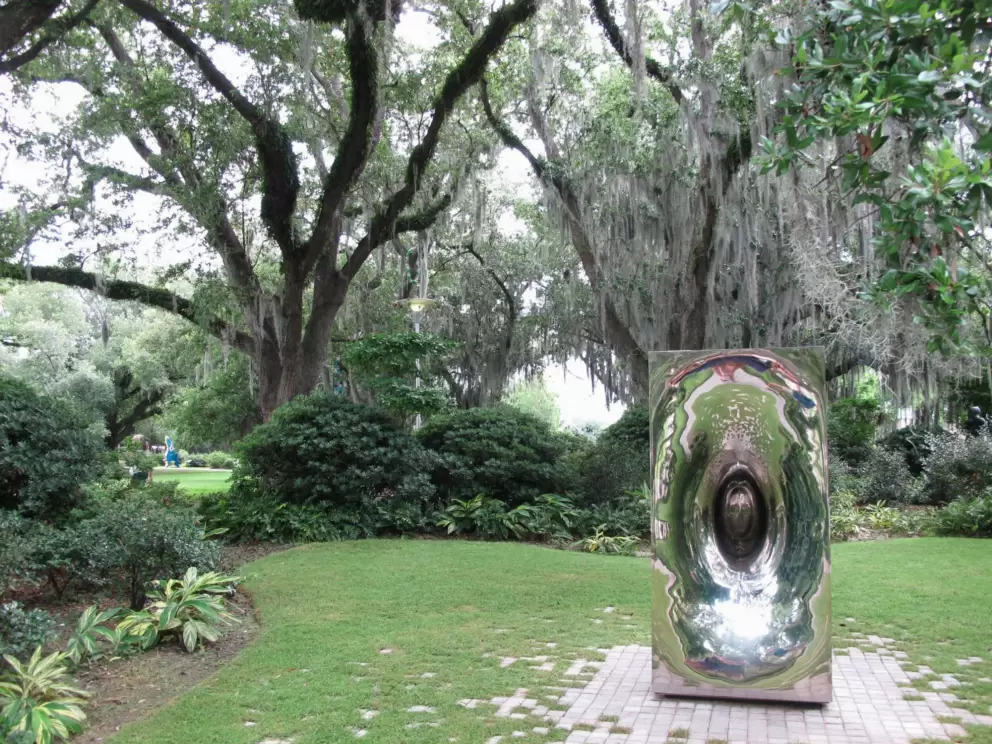 Shiny silver sculpture and gorgeous trees.