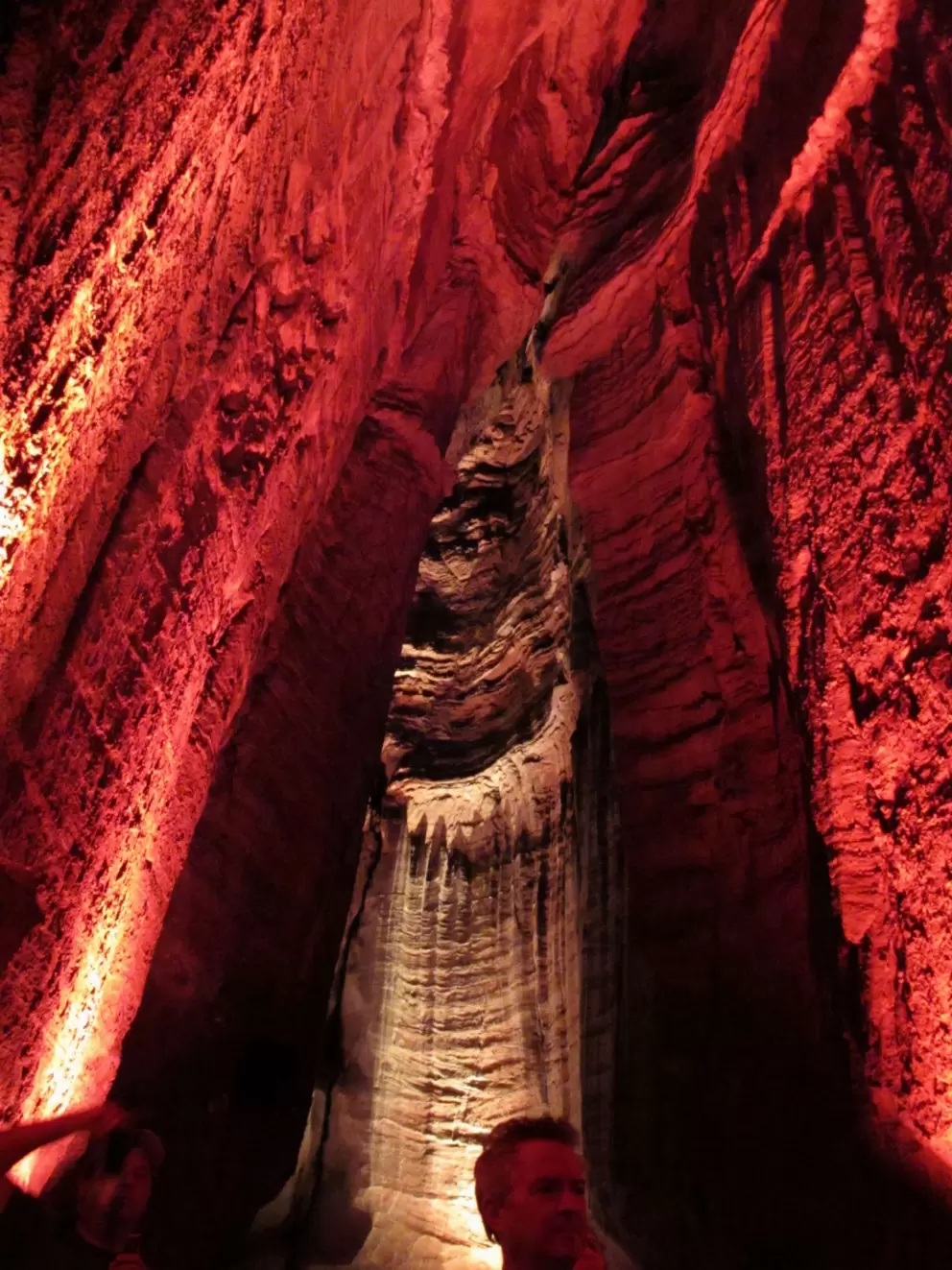 Lit cave walls near the waterfall.