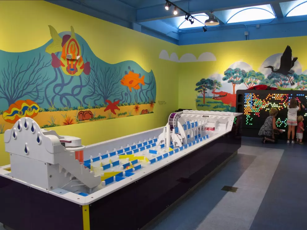 Water play station, and lit-up cylinders station.