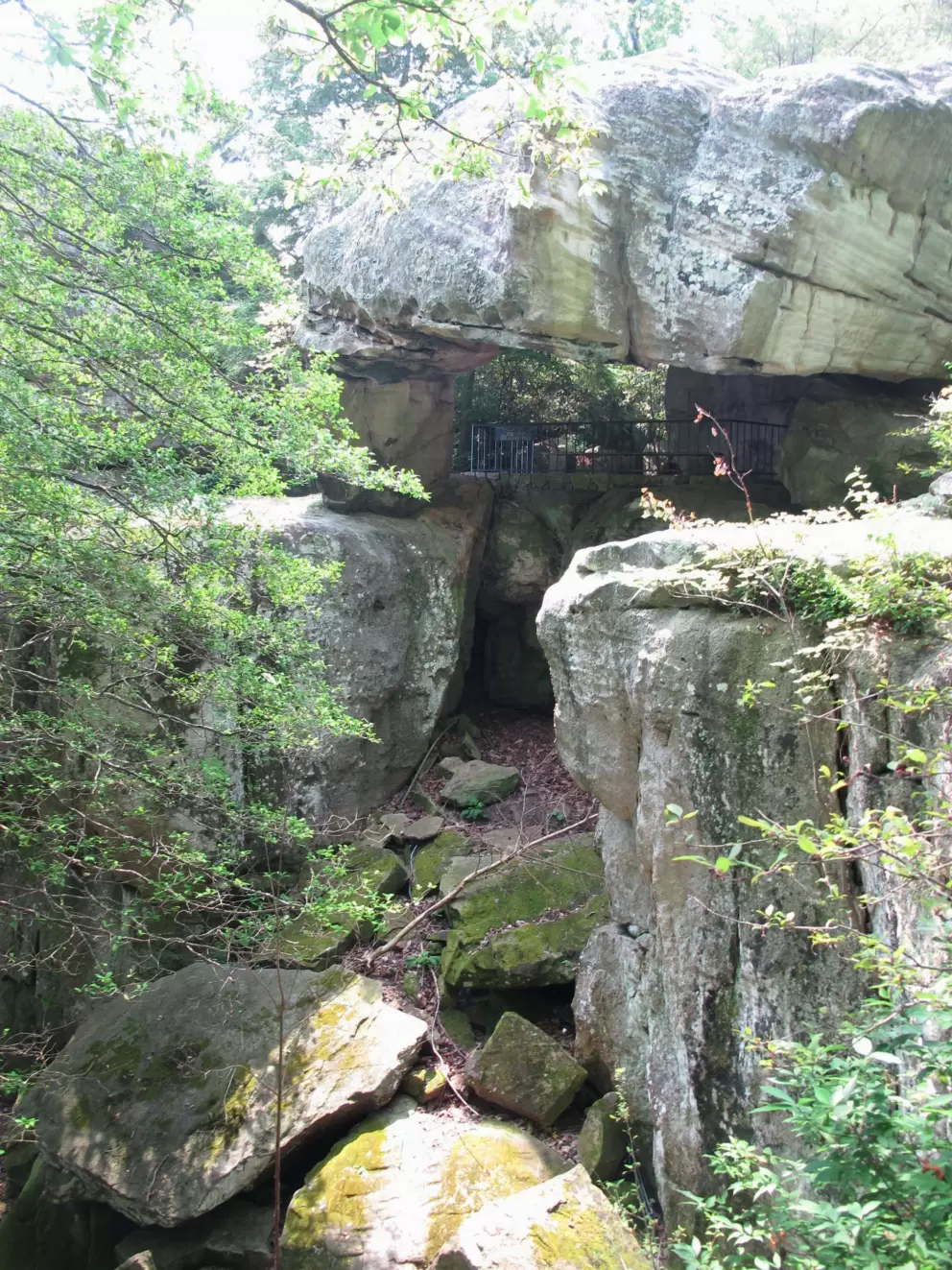 You walk under the precariously balanced rock!