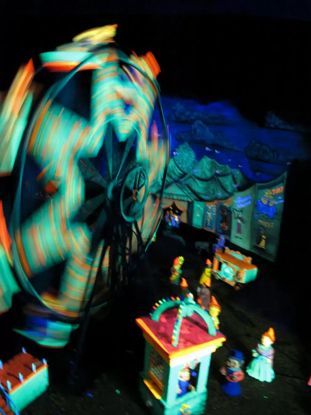 Glow-in-the-dark carousel scene in Fairyland Caverns.
