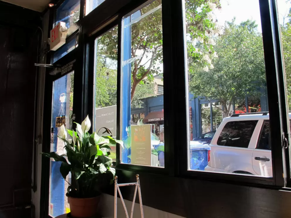 You can look out big windows at the street from Izzy's Coffee Den.