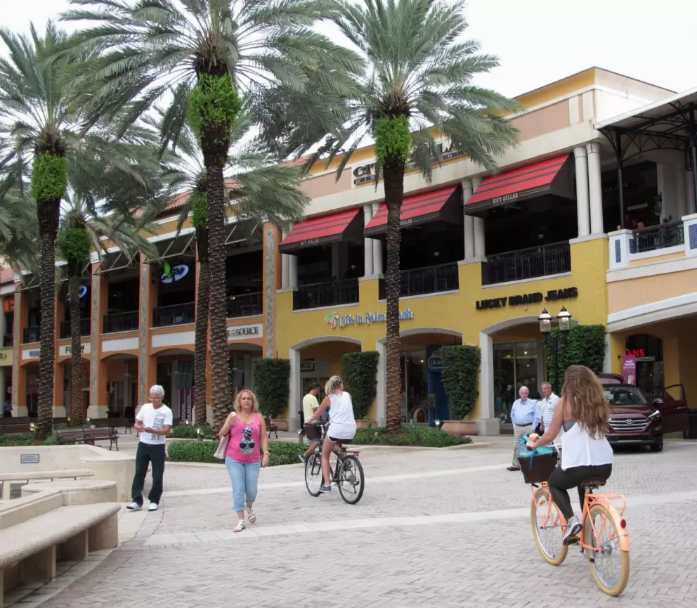 Girls riding their bikes through The Square.