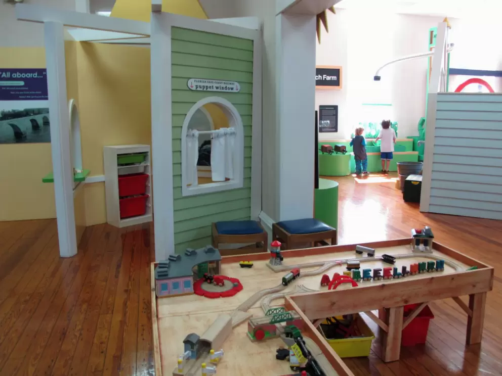 Train set and puppet theater.