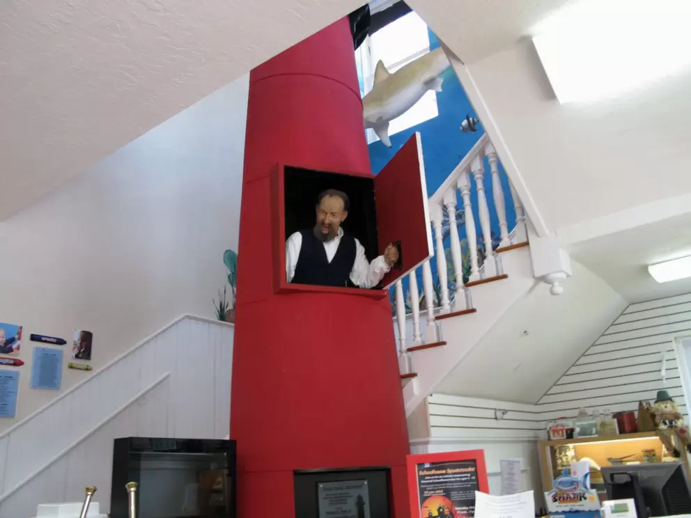 The lighthouse keeper pops out of the lighthouse window and speaks to you!