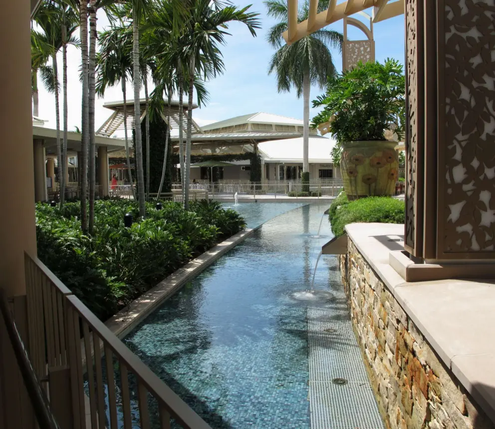 Slim palms and watery fountain areas at Waterside Shops.