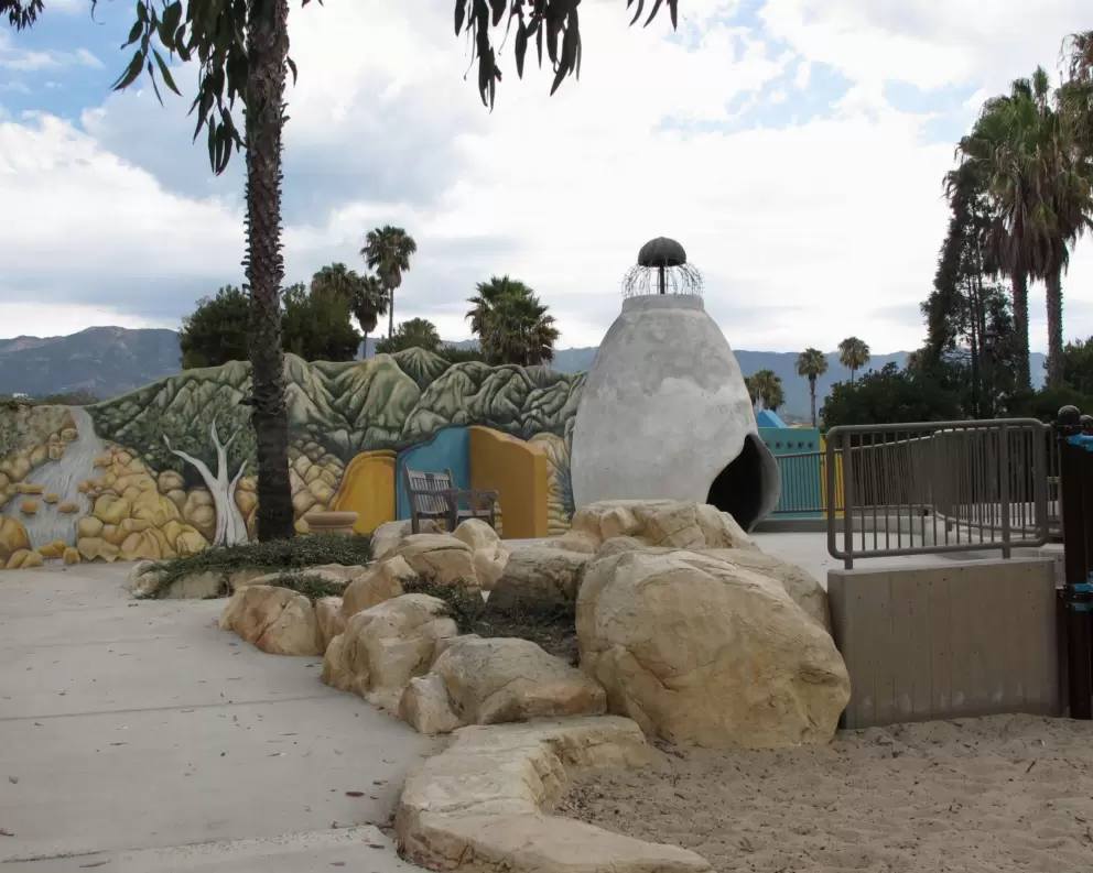 Rock boulders to climb on, and the adobe village in the distance.