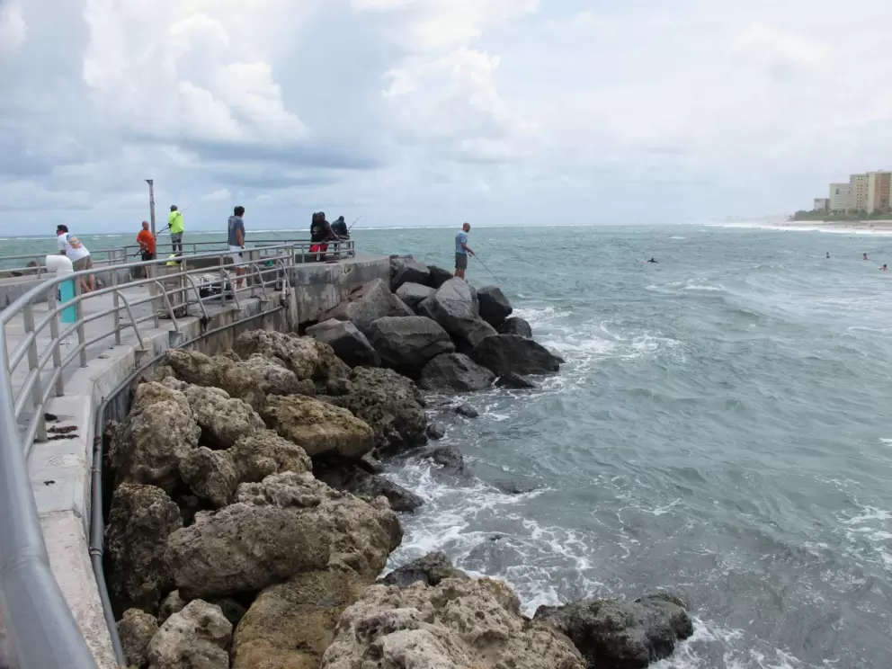 Fishermen on the end of the jetty.